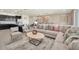 Bright living room with L-shaped sofa and open floor plan at 4289 Lana Ave, Davenport, FL 33897