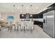 Modern kitchen with stainless steel appliances and island seating at 4289 Lana Ave, Davenport, FL 33897