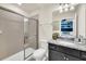 Small bathroom with shower and granite countertop at 4289 Lana Ave, Davenport, FL 33897