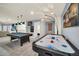 Game room with air hockey and pool table at 4289 Lana Ave, Davenport, FL 33897