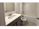 Simple bathroom with a shower/tub combo and gray vanity at 1112 Camden Way, Poinciana, FL 34758