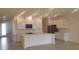 Modern kitchen featuring white cabinets and a large island at 204 Barrington Dr, Haines City, FL 33844
