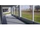 Spacious screened porch overlooking a grassy backyard at 204 Barrington Dr, Haines City, FL 33844
