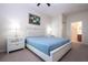 King-size bed, nightstands with lamps, and built-in closet at 2208 San Vittorino Cir # 101, Kissimmee, FL 34741