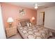 Bright bedroom with a double bed and two nightstands at 2208 San Vittorino Cir # 101, Kissimmee, FL 34741