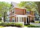 Townhouse with a white picket fence and a pergola at 2208 San Vittorino Cir # 101, Kissimmee, FL 34741