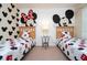 ' bedroom with twin beds and playful Mickey Mouse decor at 2208 San Vittorino Cir # 101, Kissimmee, FL 34741