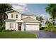 Two-story home with two-car garage and landscaping at 106 Elena Lavin Cir # 16, Orlando, FL 32807