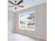 Bright office features a large window and ceiling fan at 10625 Summit Lakes Ln, Clermont, FL 34711
