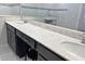 Double vanity bathroom with quartz countertop and dark cabinets at 5692 Camilla St, St Cloud, FL 34771