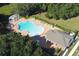 Community pool with pergola and lounge area at 5692 Camilla St, St Cloud, FL 34771