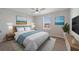 Spacious bedroom with a queen-sized bed and TV at 5692 Camilla St, St Cloud, FL 34771
