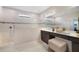 Elegant bathroom with walk-in shower, double vanity, and modern fixtures at 5692 Camilla St, St Cloud, FL 34771