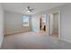 Bright bedroom featuring a ceiling fan and neutral decor at 5692 Camilla St, Saint Cloud, FL 34771