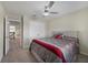Comfortable bedroom with ceiling fan and grey bedding at 5692 Camilla St, St Cloud, FL 34771