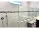 Walk-in shower with glass enclosure and modern tile at 5692 Camilla St, St Cloud, FL 34771