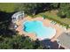 Community pool with pergola and lounge area at 5692 Camilla St, St Cloud, FL 34771