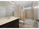 Clean bathroom with tub, shower, and light vanity at 5692 Camilla St, Saint Cloud, FL 34771