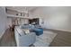 Open living room with sectional sofa and high ceilings at 5692 Camilla St, St Cloud, FL 34771