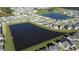 Aerial view of community with lake at 5692 Camilla St, St Cloud, FL 34771
