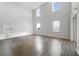 Bright living room with hardwood floors and large windows at 5692 Camilla St, St Cloud, FL 34771