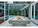 Inviting pool area with a pool table and screened enclosure at 310 Vista Oak Dr, Longwood, FL 32779