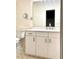 Bathroom with white vanity and patterned wallpaper at 310 Vista Oak Dr, Longwood, FL 32779