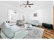Open sitting room with hardwood floors, light-colored sofas and a view of the entry hall at 310 Vista Oak Dr, Longwood, FL 32779