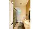 Modern bathroom with granite countertop and glass shower enclosure at 310 Vista Oak Dr, Longwood, FL 32779