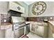 Outdoor kitchen with stainless steel appliances and built-in grill at 310 Vista Oak Dr, Longwood, FL 32779