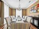 Formal dining room with hardwood floors, chandelier, and large windows at 310 Vista Oak Dr, Longwood, FL 32779