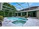 Relaxing pool and spa area with a screened enclosure at 310 Vista Oak Dr, Longwood, FL 32779