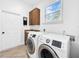 Laundry room with washer, dryer, cabinets, and utility sink at 310 Vista Oak Dr, Longwood, FL 32779