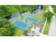 Community tennis and basketball courts near a pond at 310 Vista Oak Dr, Longwood, FL 32779