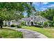 Two-story home with a circular driveway and landscaping at 310 Vista Oak Dr, Longwood, FL 32779