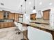 Kitchen island with seating, granite countertops, and stainless steel appliances at 310 Vista Oak Dr, Longwood, FL 32779