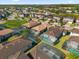 Aerial view of neighborhood with multiple houses and pools at 196 Aidans Lndg, Haines City, FL 33844