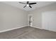 Bedroom with ceiling fan and access to the patio at 196 Aidans Lndg, Haines City, FL 33844