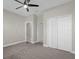 Bright bedroom with ceiling fan and access to bathroom at 196 Aidans Lndg, Haines City, FL 33844