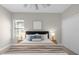 Comfortable bedroom with ceiling fan, neutral decor, and ample closet space at 196 Aidans Lndg, Haines City, FL 33844