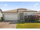 Single-story home with gray exterior, tile roof, and a two-car garage at 196 Aidans Lndg, Haines City, FL 33844
