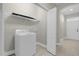 Convenient laundry room with washer, dryer, and shelving at 196 Aidans Lndg, Haines City, FL 33844