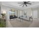 Spacious living area with comfy seating and access to the back patio at 196 Aidans Lndg, Haines City, FL 33844