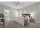 Spacious main bedroom with en-suite bathroom and plush carpeting at 196 Aidans Lndg, Haines City, FL 33844