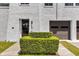 Front entrance with lush landscaping and a modern garage door at 601 E Ridgewood St, Orlando, FL 32803