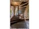 Rustic wood spiral staircase with brick walls at 601 E Ridgewood St, Orlando, FL 32803