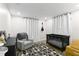 Bedroom with crib, armchair, and geometric patterned rug at 4041 Yacht Ct, Winter Park, FL 32792