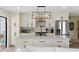 Updated kitchen with white cabinets, large island and stainless steel appliances at 4041 Yacht Ct, Winter Park, FL 32792