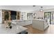 Open concept living space with a stone fireplace and kitchen island at 4041 Yacht Ct, Winter Park, FL 32792