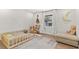 bedroom with toddler bed, seating, and neutral decor at 4041 Yacht Ct, Winter Park, FL 32792